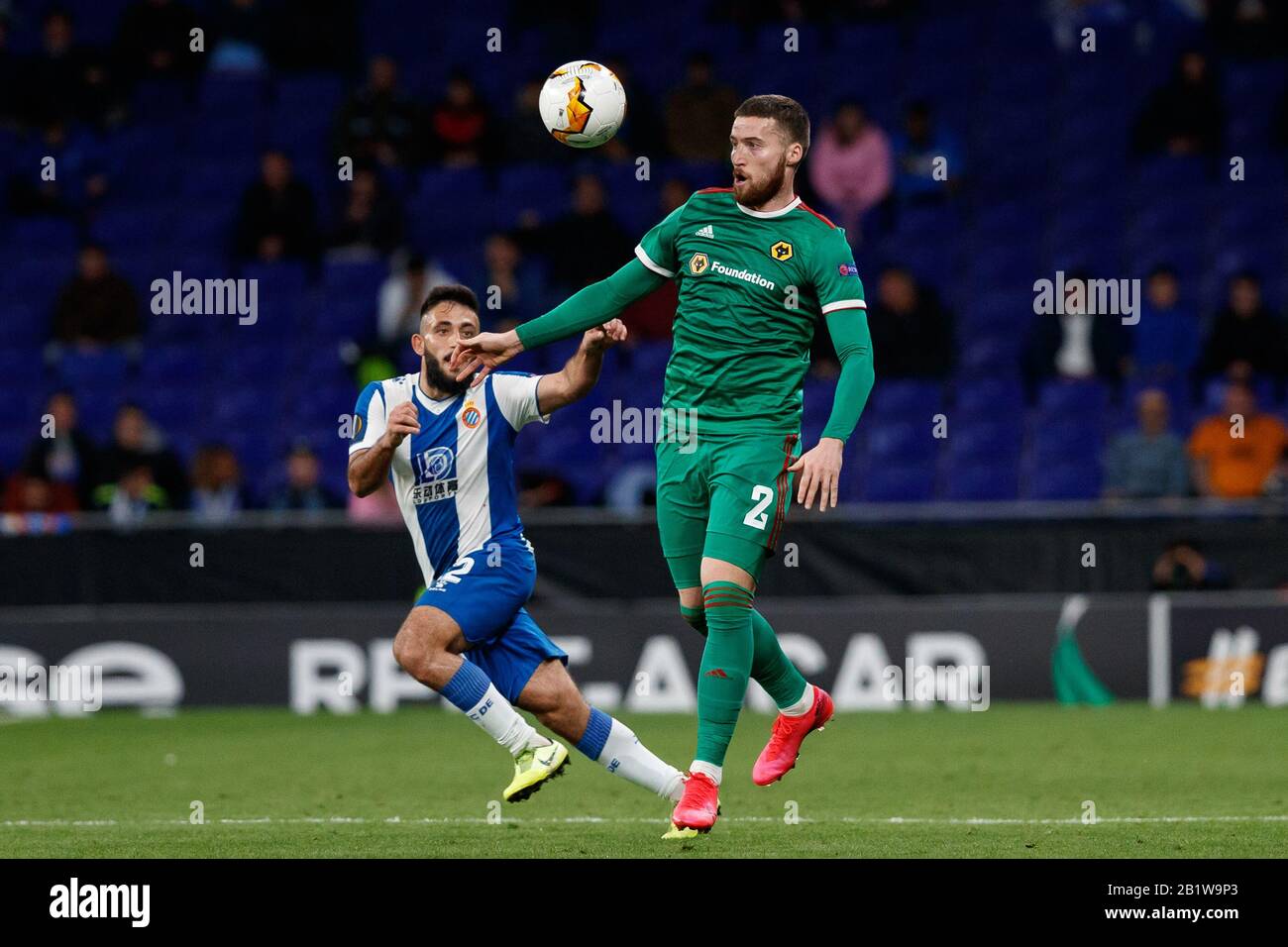 Barcelona, Spain. 27th Feb 2020.  Matt Doherty of Wolverhampton Wanderers F.C. in action with Matias Vargas of RCD Espanyol during the UEFA Europa League round of 32 second leg match between RCD Espanyol and Wolverhampton Wanderers at RCD Stadium on February 27, 2020 in Barcelona, Spain. Credit: Dax Images/Alamy Live News Stock Photo