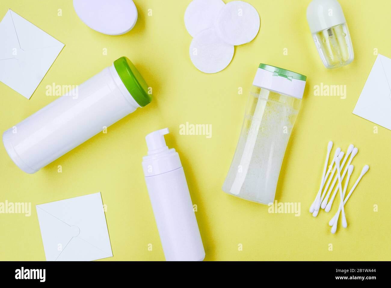 Packaging for cosmetics without labels on a yellow background. Cosmetic products background Stock Photo