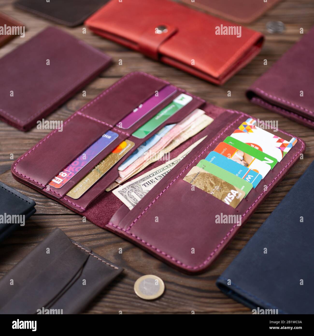 Ukraine Kyiv 02 19 Purple Handmade Leather Porte Monnaie With Money And Cards On Wooden Background Side View Editorial Use Only Stock Photo Alamy