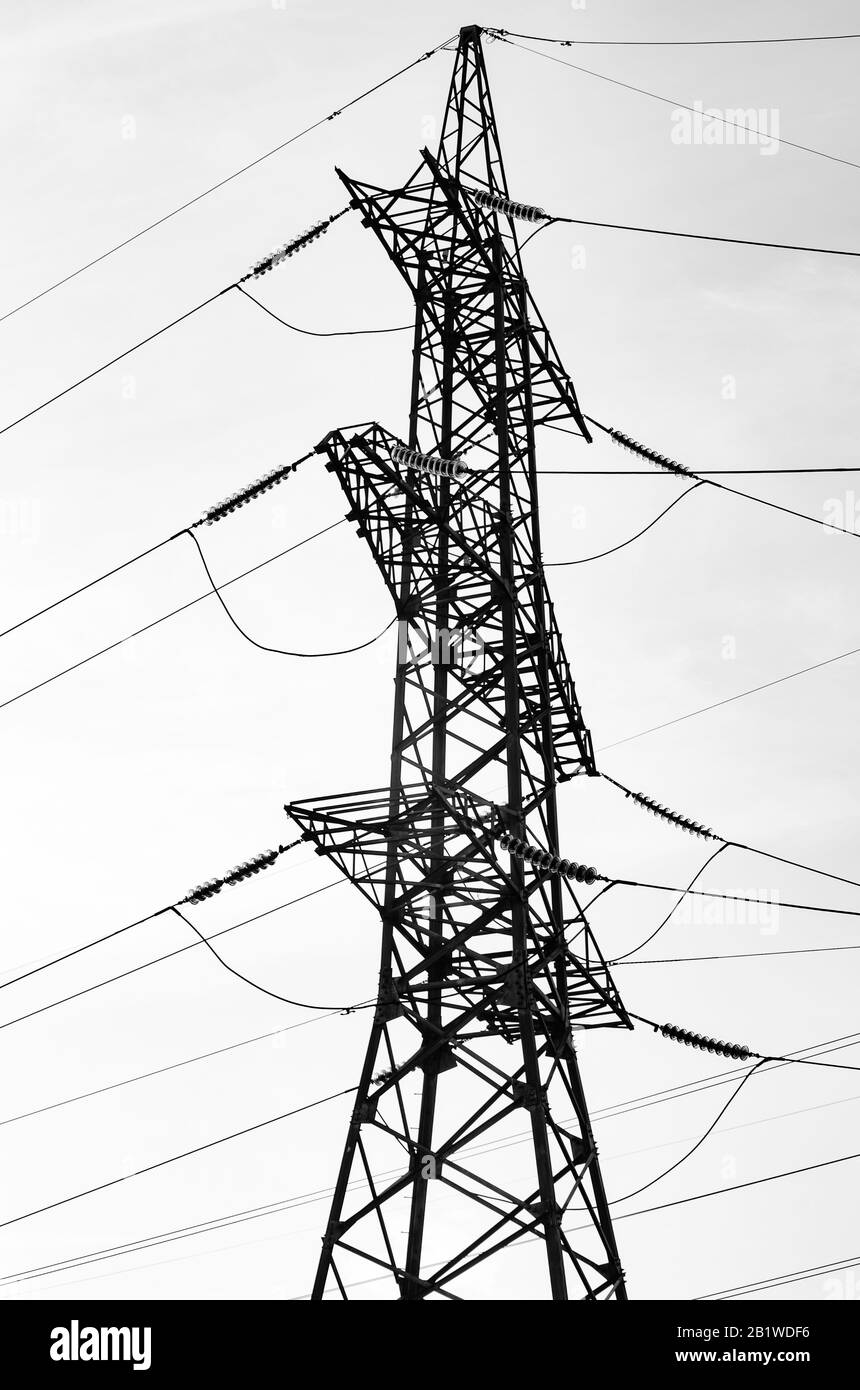 Pylon of a high voltage power line. Black and white image. Stock Photo