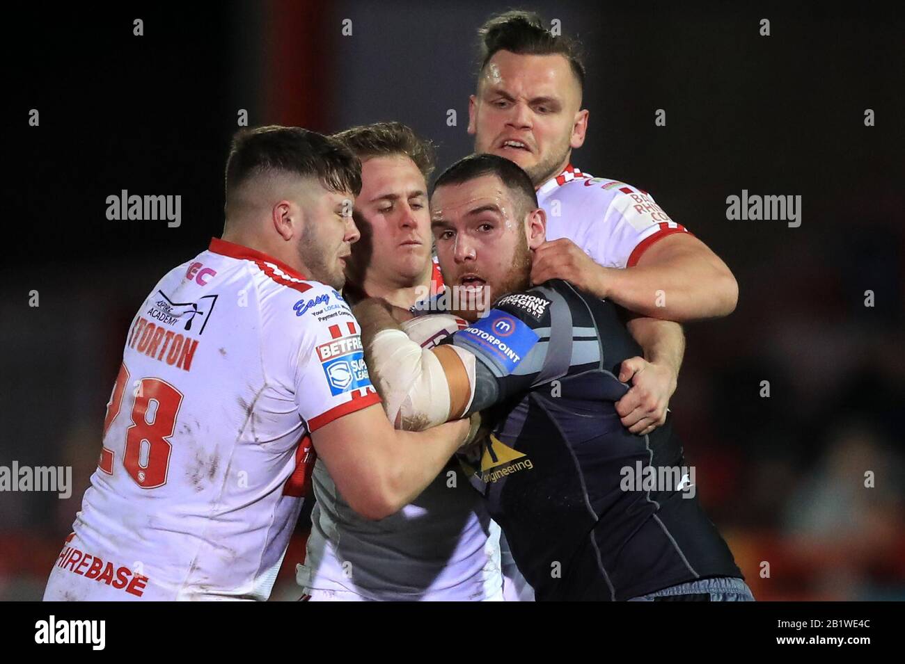 Castleford Tigers' Daniel Smith (right) is tackled down during the Betfred Super League match at Craven Park, Hull. Stock Photo