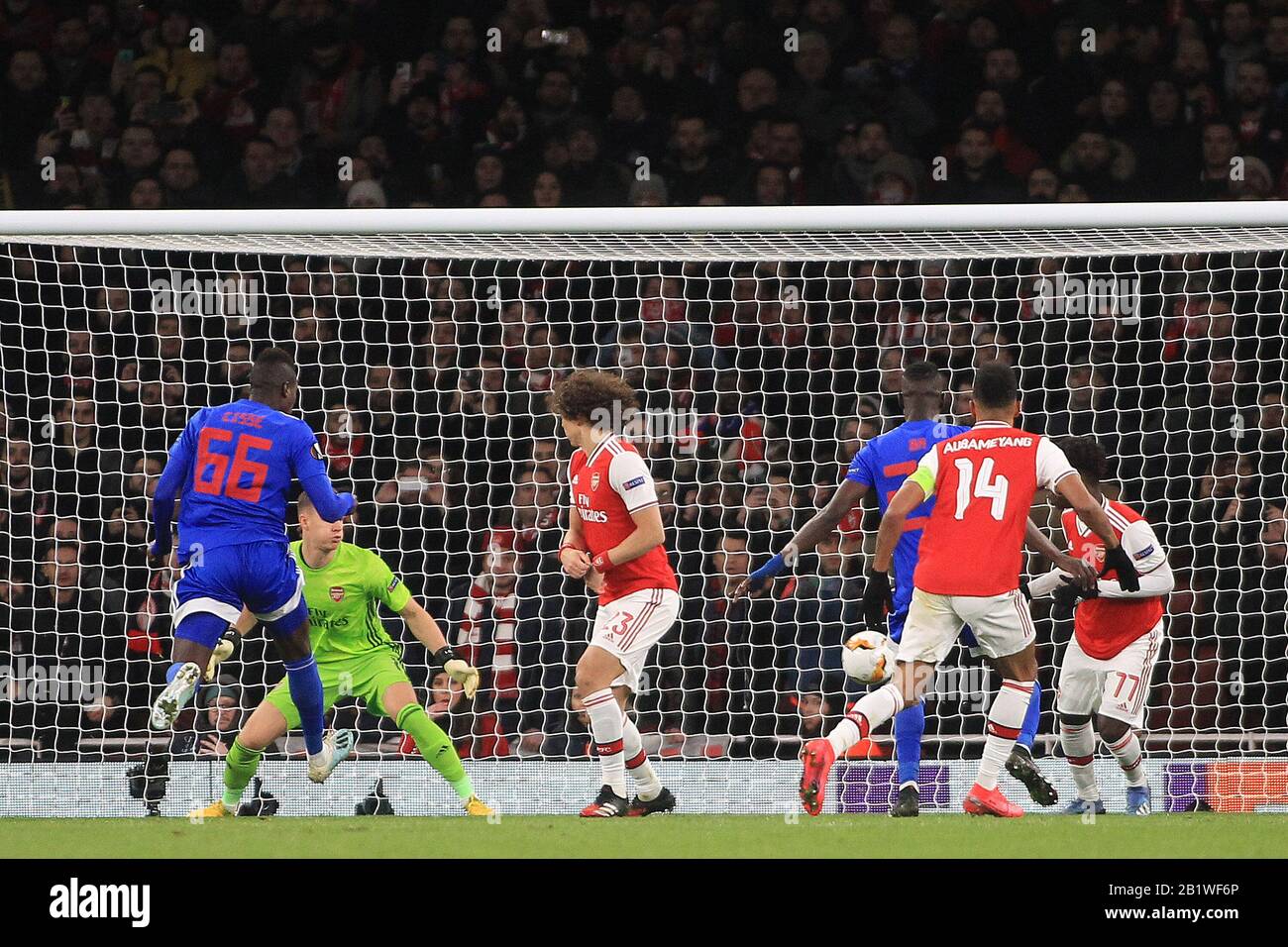 London, UK. 27th Feb, 2020. Pape Abou Cisse of Olympiakos (66) scores his  team's first goal. UEFA Europa league, round of 32, 2nd leg match, Arsenal  v Olympiacos at the Emirates Stadium