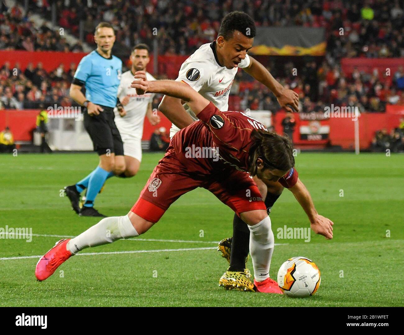 Seville Spain 27th Feb 2020 Sevilla Fc S Jules Kounde Back In Action Against Cfr Cluj S Constantin Paun R During A Uefa Europa League Round Of 32 Second Leg Soccer Match Between Sevilla