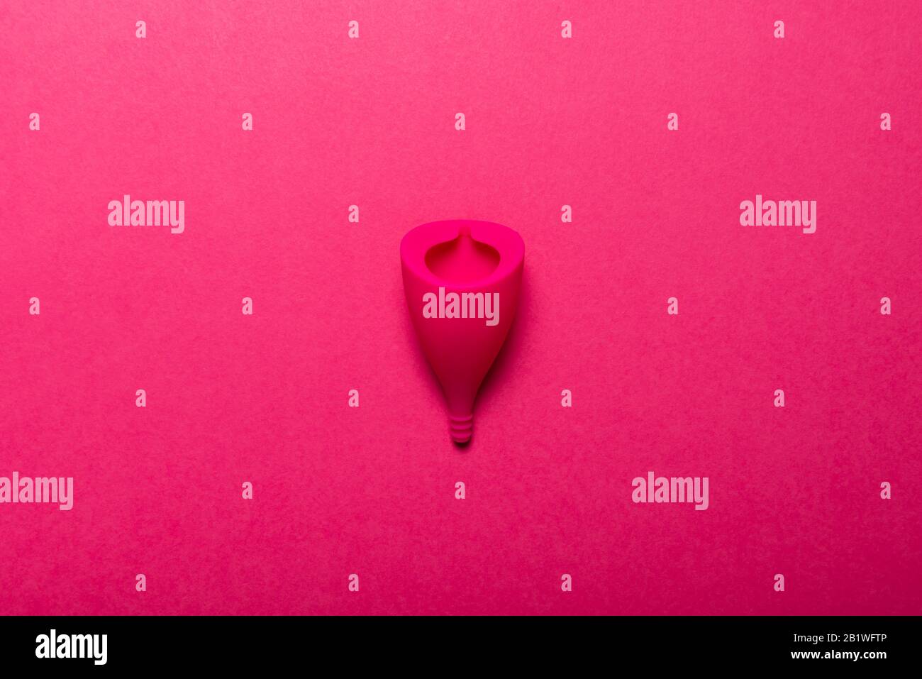 Hygiene item for womens critical days, such as menstrual cup. Alternative healthy option for womens health. Top view, flat lay, concept of womens health issues Stock Photo