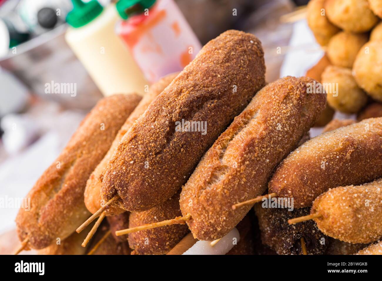 Traditional South Korean corn dogs at a street food market. Stock Photo