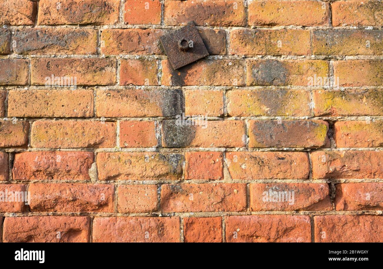 Rusty iron brick wall support Stock Photo Alamy