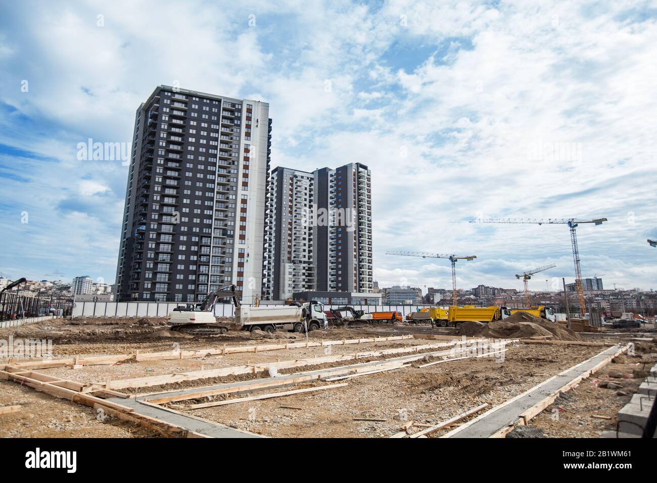 Residential Construction Site, New Apartment Building Industry, Tower Cranes And Industrial Machinery Stock Photo