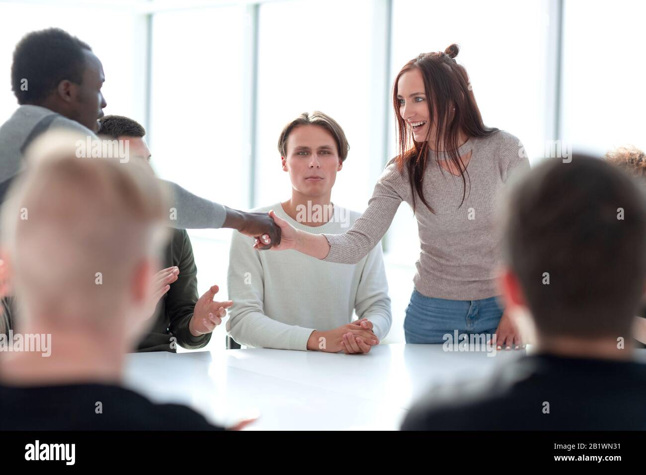 Standing together round a table hires stock photography and images Alamy
