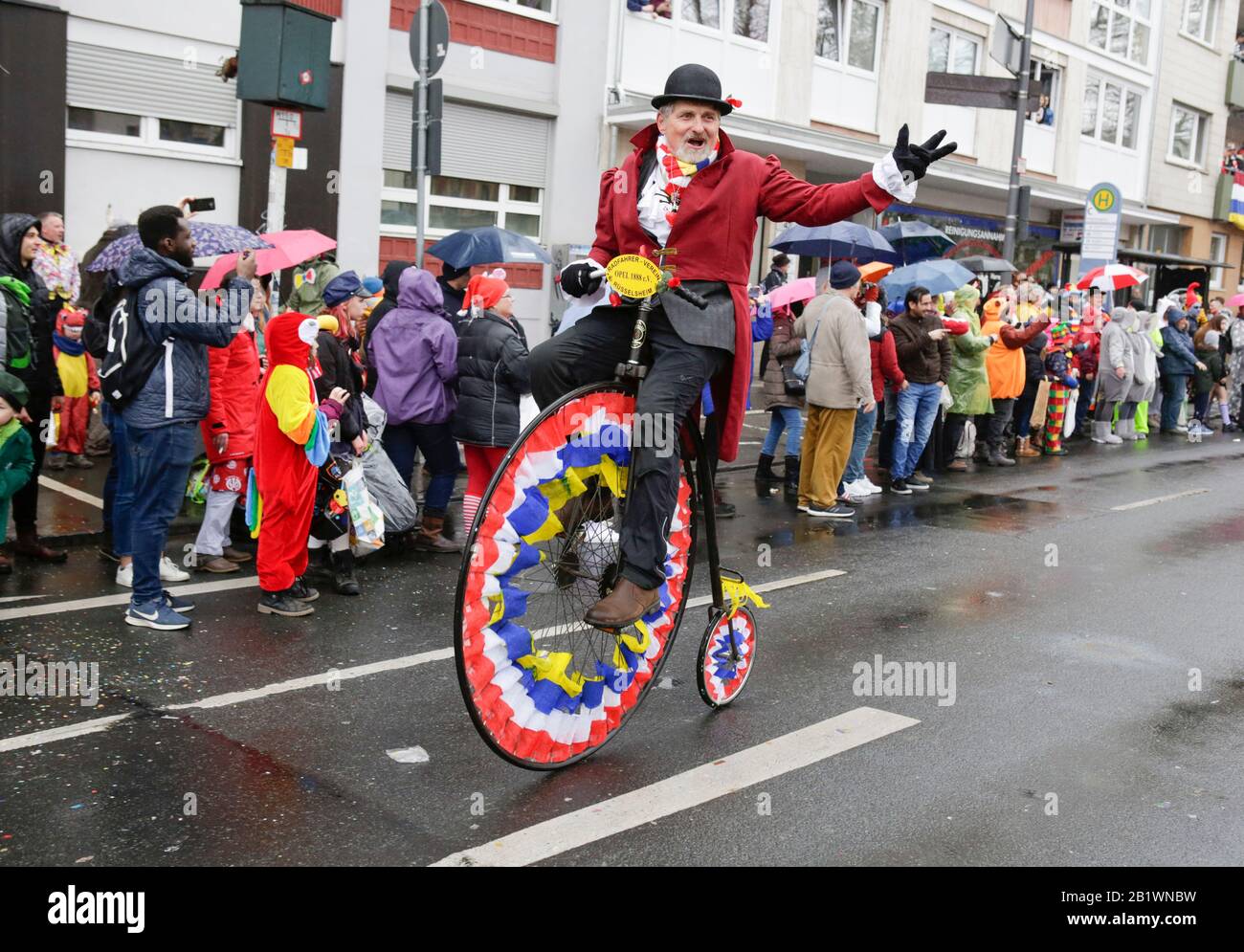 Mainz, Germany. 24th February 2020. A member of the Bicycle-Club Opel 1888 Ruesselsheim takes part in the the Mainz Rose Monday parade on a penny-farthing. Around half a million people lined the streets of Mainz for the traditional Rose Monday Carnival Parade. The 9 km long parade with over 9,000 participants is one of the three large Rose Monday Parades in Germany. Stock Photo