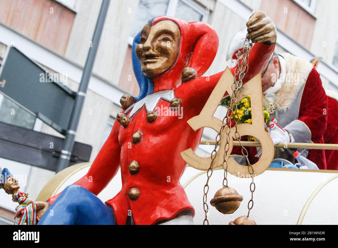 Mainz, Germany. 24th February 2020. A jester figure sits on a float from the Mainzer Carneval Club in the Mainz Rose Monday parade. Around half a million people lined the streets of Mainz for the traditional Rose Monday Carnival Parade. The 9 km long parade with over 9,000 participants is one of the three large Rose Monday Parades in Germany. Stock Photo