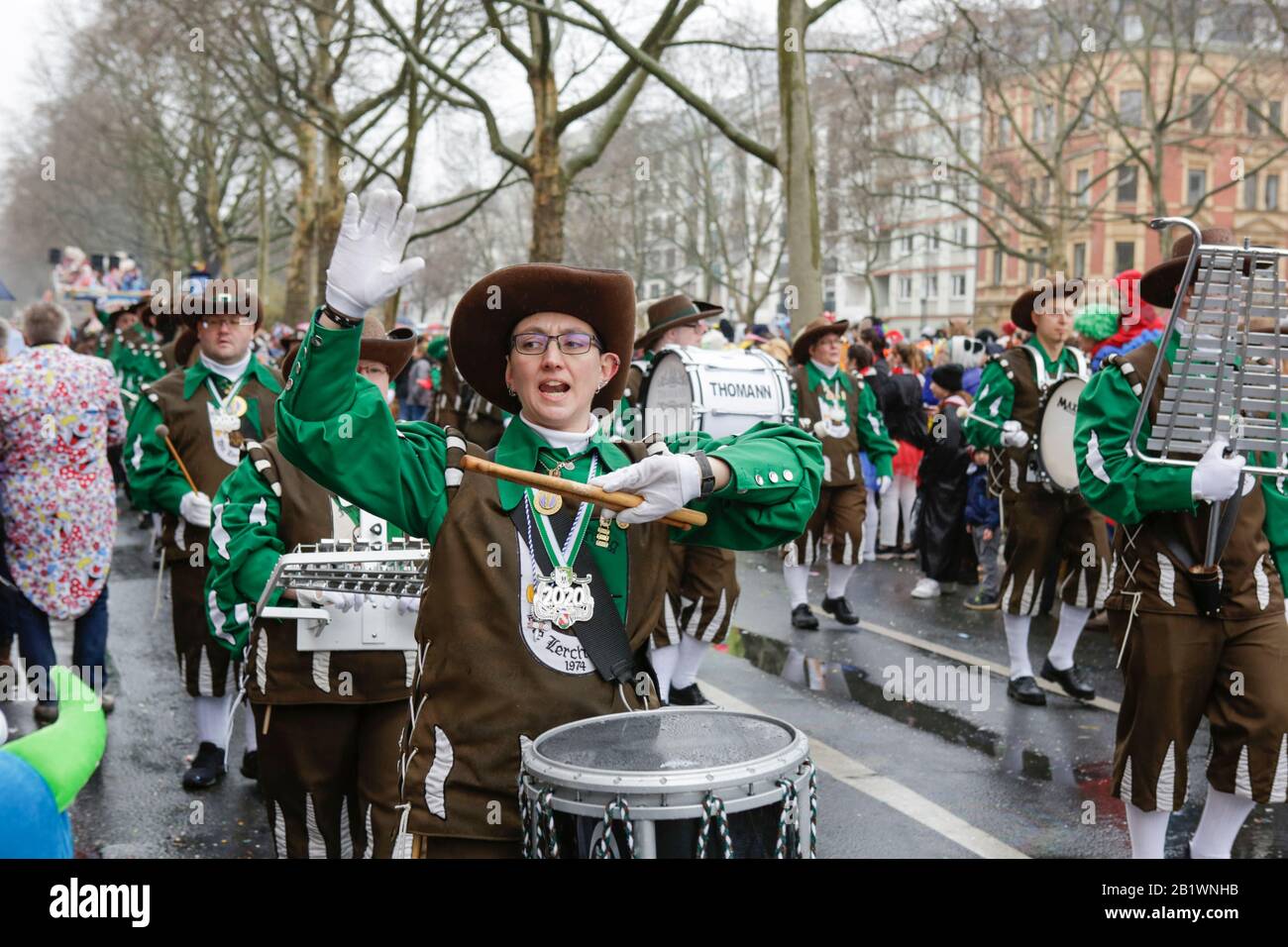 Mainz, Germany. 24th February 2020. Members of the fanfare band Fanfarenzug Die Lerchen Mainz march in the the Mainz Rose Monday parade. Around half a million people lined the streets of Mainz for the traditional Rose Monday Carnival Parade. The 9 km long parade with over 9,000 participants is one of the three large Rose Monday Parades in Germany. Stock Photo