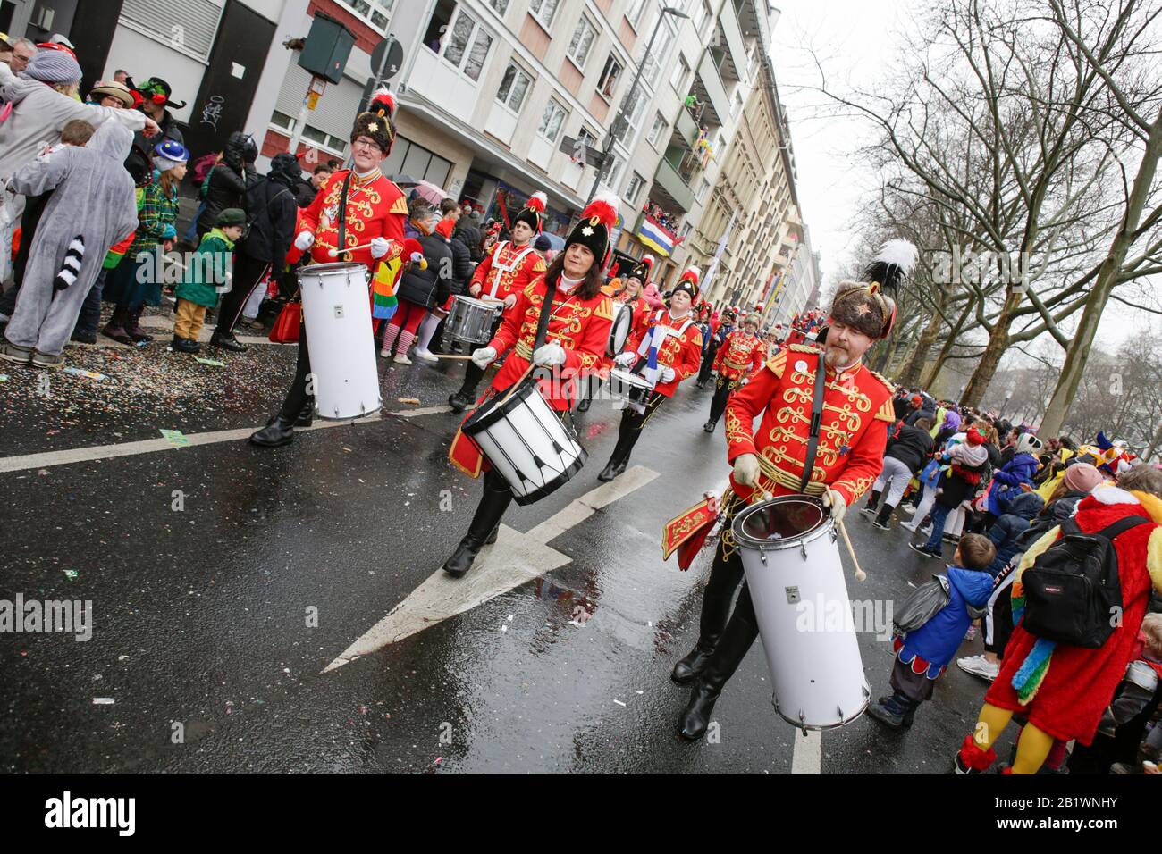Mainz, Germany. 24th February 2020. Members of the marching band of the carnival guards C.C. Rote Husaren Mainz-Kostheim march in the Mainz Rose Monday parade. Around half a million people lined the streets of Mainz for the traditional Rose Monday Carnival Parade. The 9 km long parade with over 9,000 participants is one of the three large Rose Monday Parades in Germany. Stock Photo
