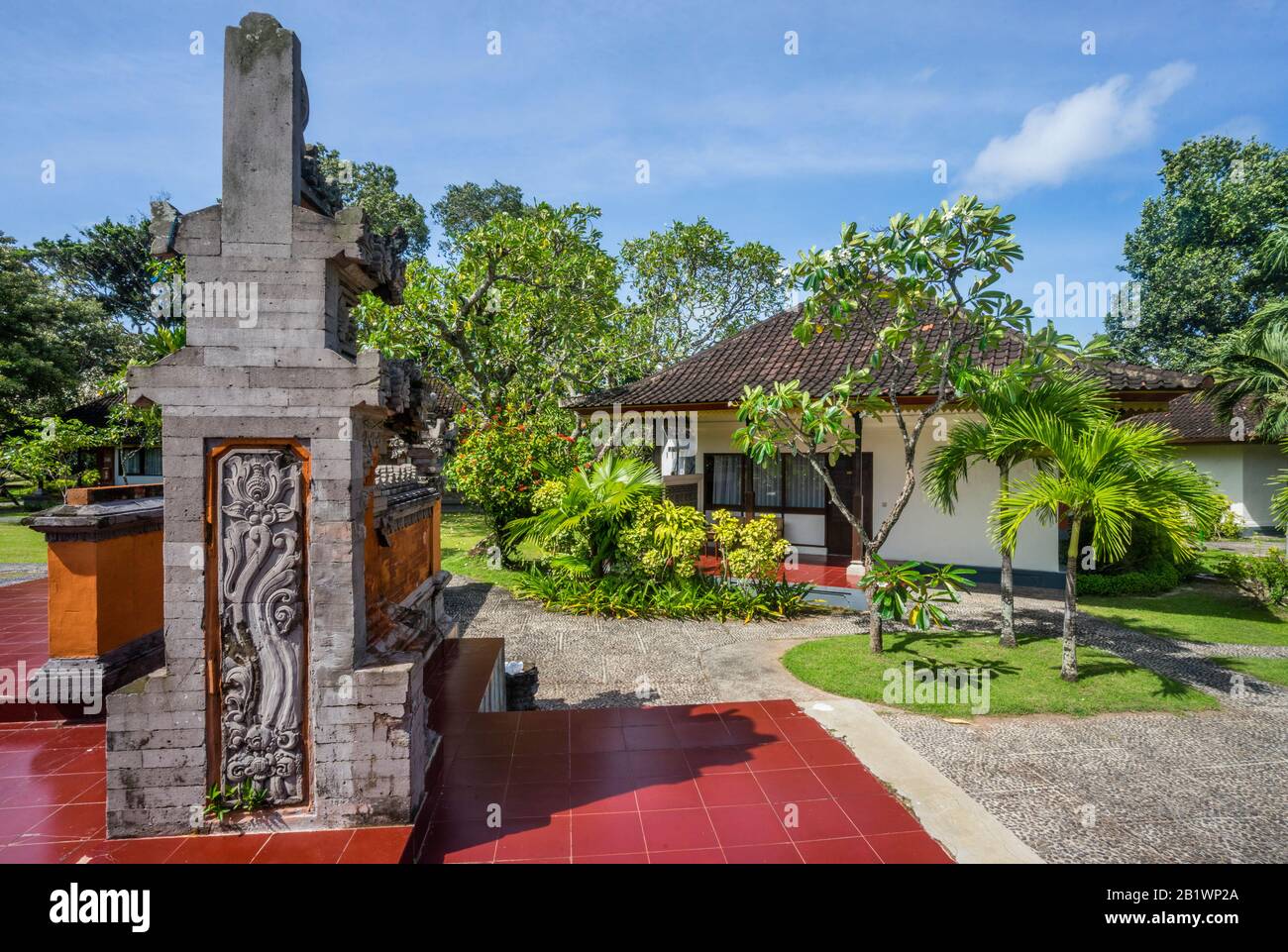 sculpture adorned landscaped gardens of Ina Bali Beach Resort, Sanur, Bali, Indonesia Stock Photo
