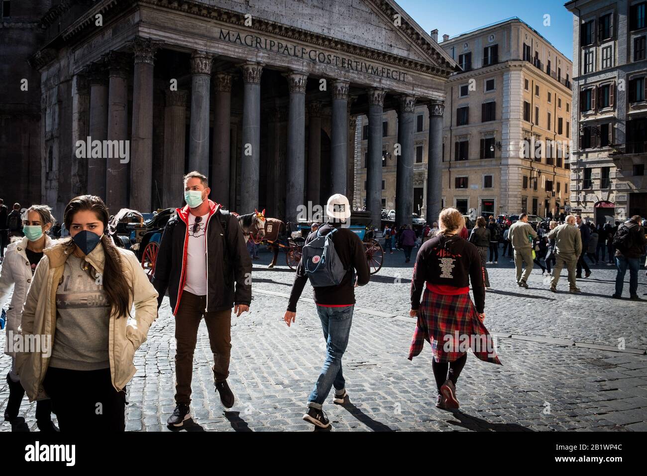 Rome, Italy. 27th Feb, 2020. ROME, ITALY - FEBRUARY 27, Tourists wear  protective masks to protect themselves from Covid-19 Coronavirus, in the  Pantheom, February 27, 2020 in Rome, Italy. The number of