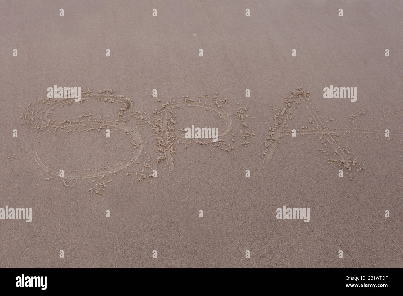 Label SPA on beach. Sand inscription - SPA Stock Photo - Alamy