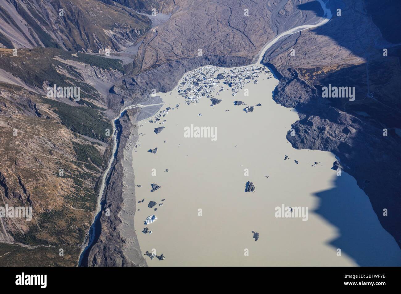 Tasman Lake is a proglacial lake formed by the recent retreat of the Tasman Glacier. The lake is contained by high moraine ridges on three sides. Stock Photo