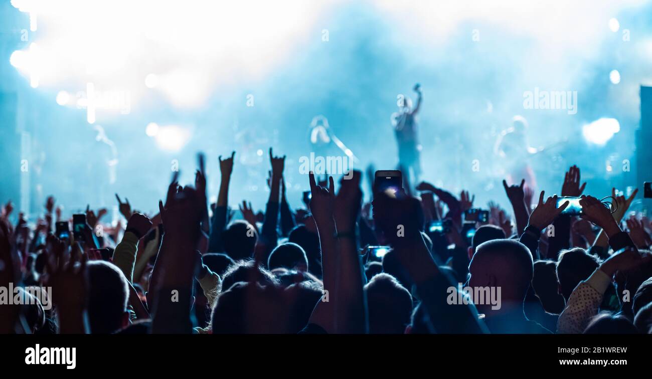 Audience crowd people raise hands enjoy live music festival concert event  Stock Photo - Alamy