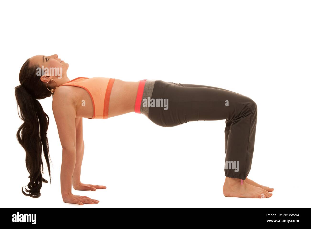 Yoga practice - beautiful young woman with black hair exercise yoga . Stock Photo