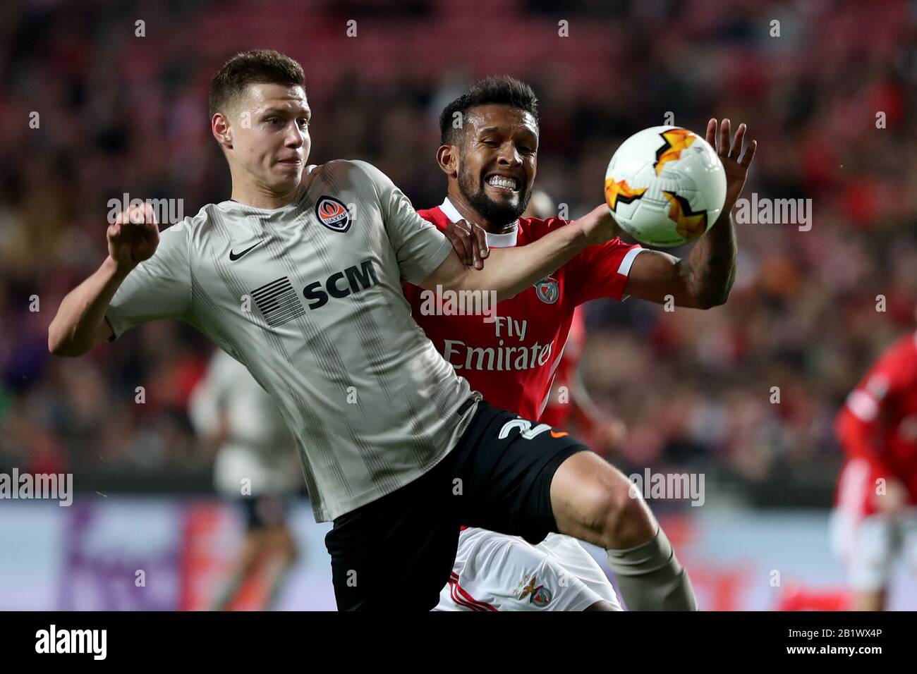 Lisbon, Portugal. 27th Feb, 2020. Mykola Matvienko of Shakhtar Donetsk (L) vies with Dyego Sousa of SL Benfica during the UEFA Europa League round of 32 second leg football match between SL Benfica and Shakhtar Donetsk at Luz stadium in Lisbon, Portugal, on February 27, 2020. Credit: Pedro Fiuza/ZUMA Wire/Alamy Live News Stock Photo
