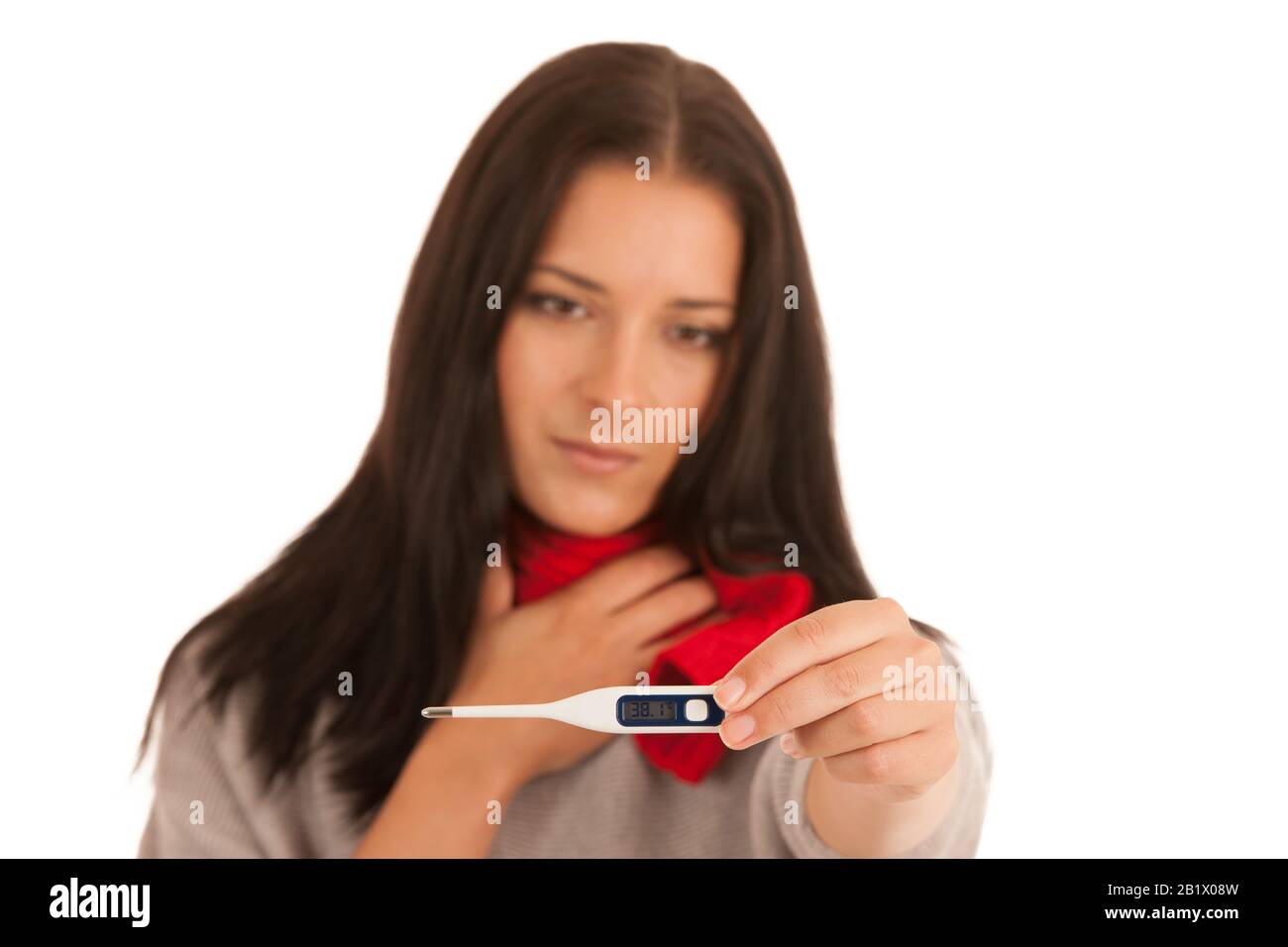 Ill woman has fever checking body temperature with thermometer isolated over white background Stock Photo