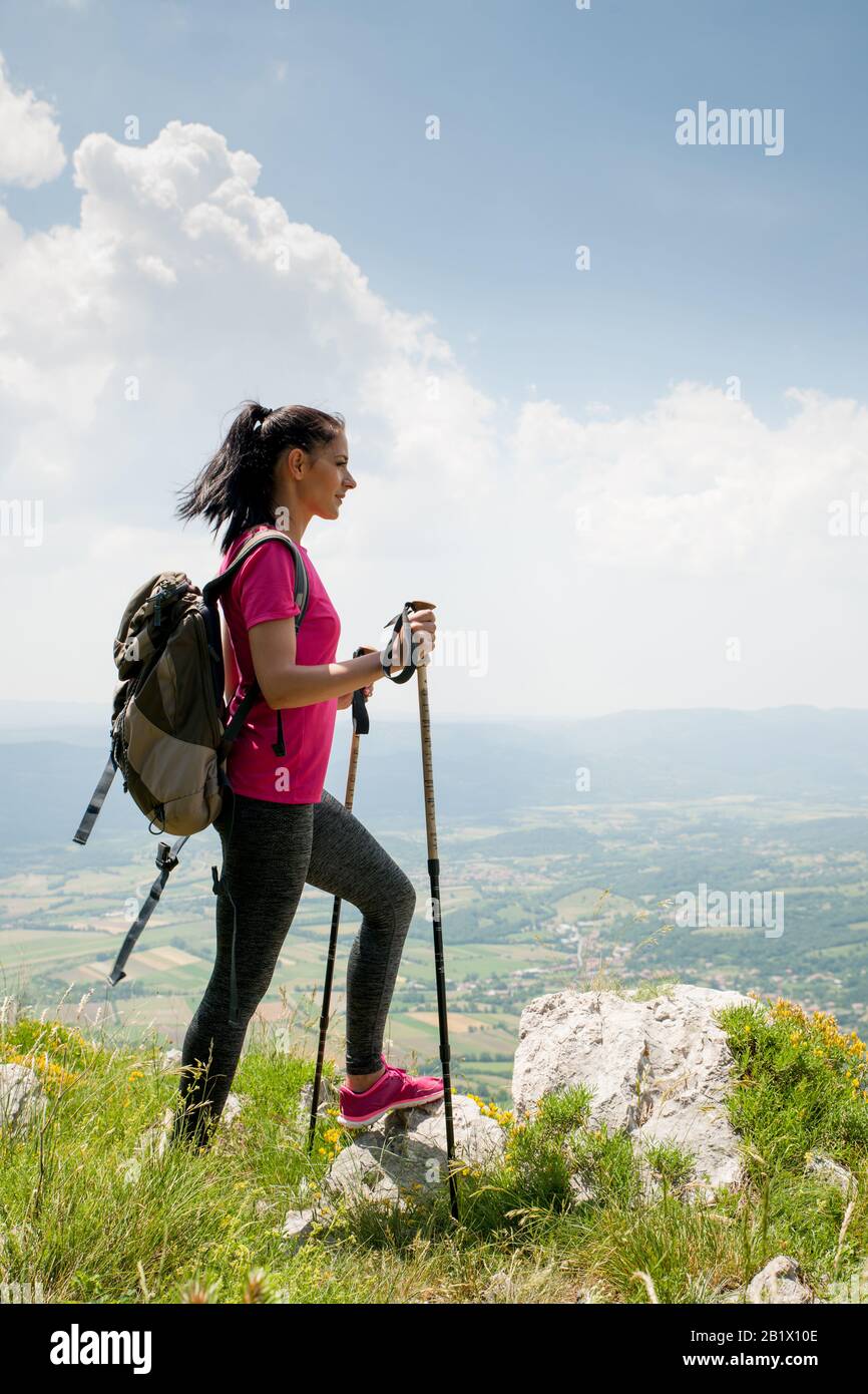 Young hiker climbing on hill hi-res stock photography and images - Alamy