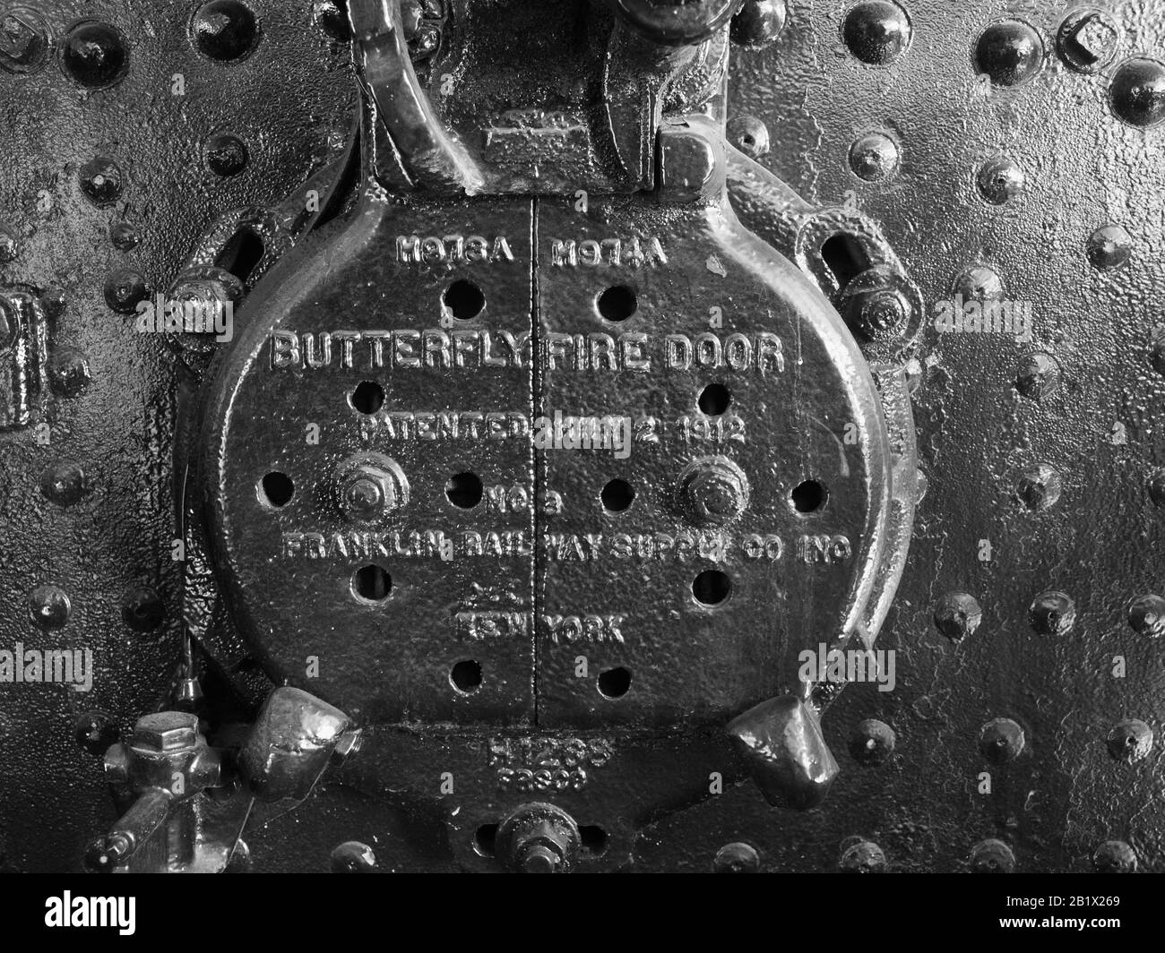 Butterfly doors on the fire box of a Shay steam engine Stock Photo