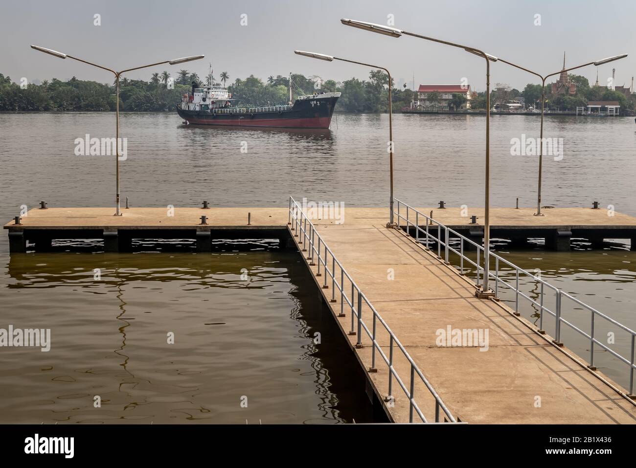 Small pier Extending to the Chao Phraya River in Bangkok. Thailand ...