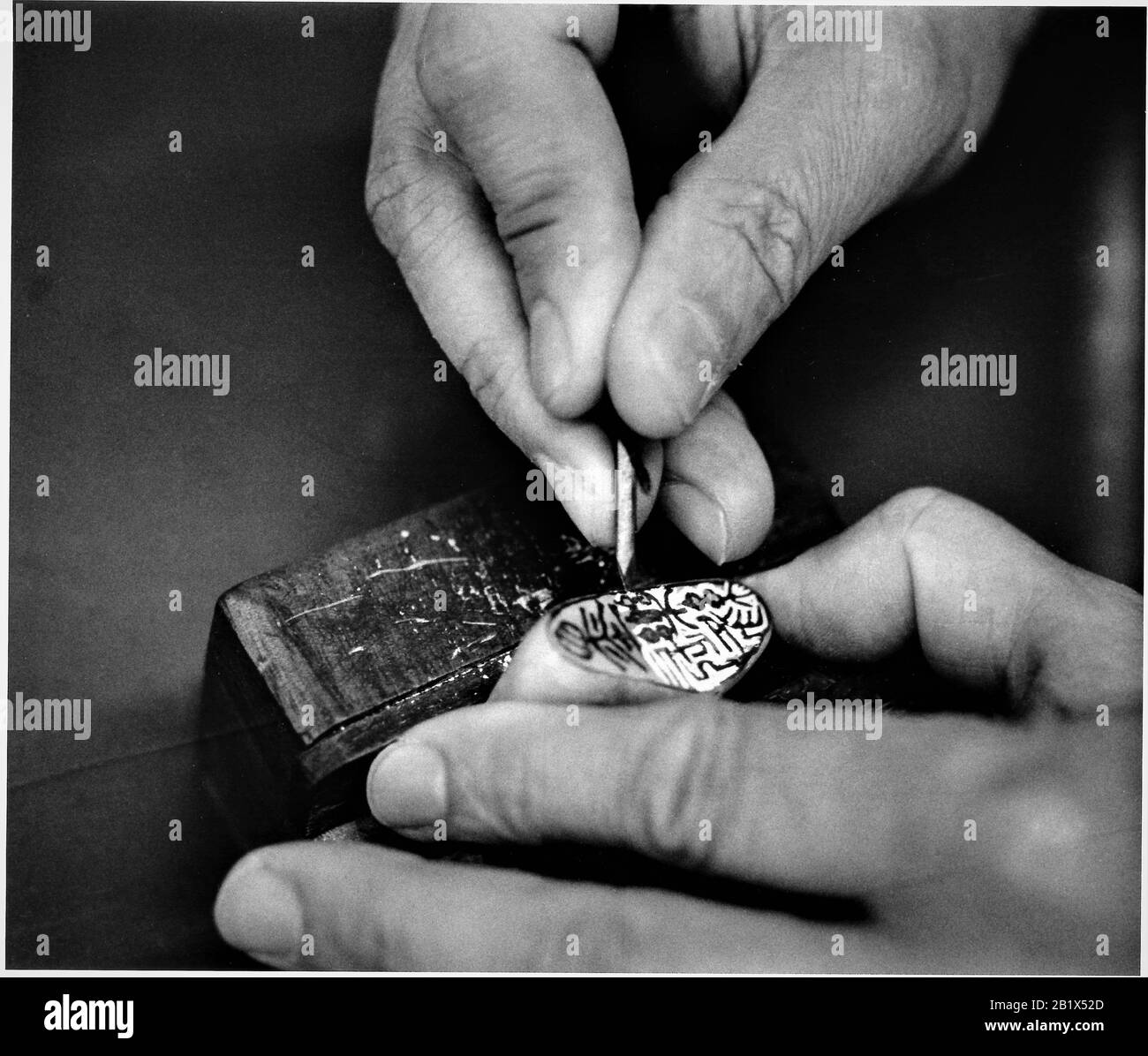 Making a Chinese stone chop by hand in LA's 'China town' Stock Photo