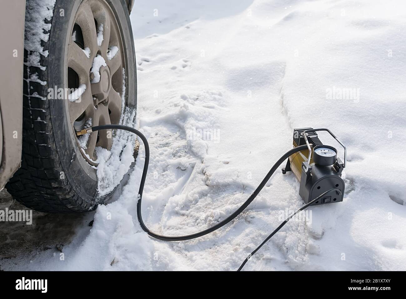 pump, automobile compressor for inflating tires with air stands in the