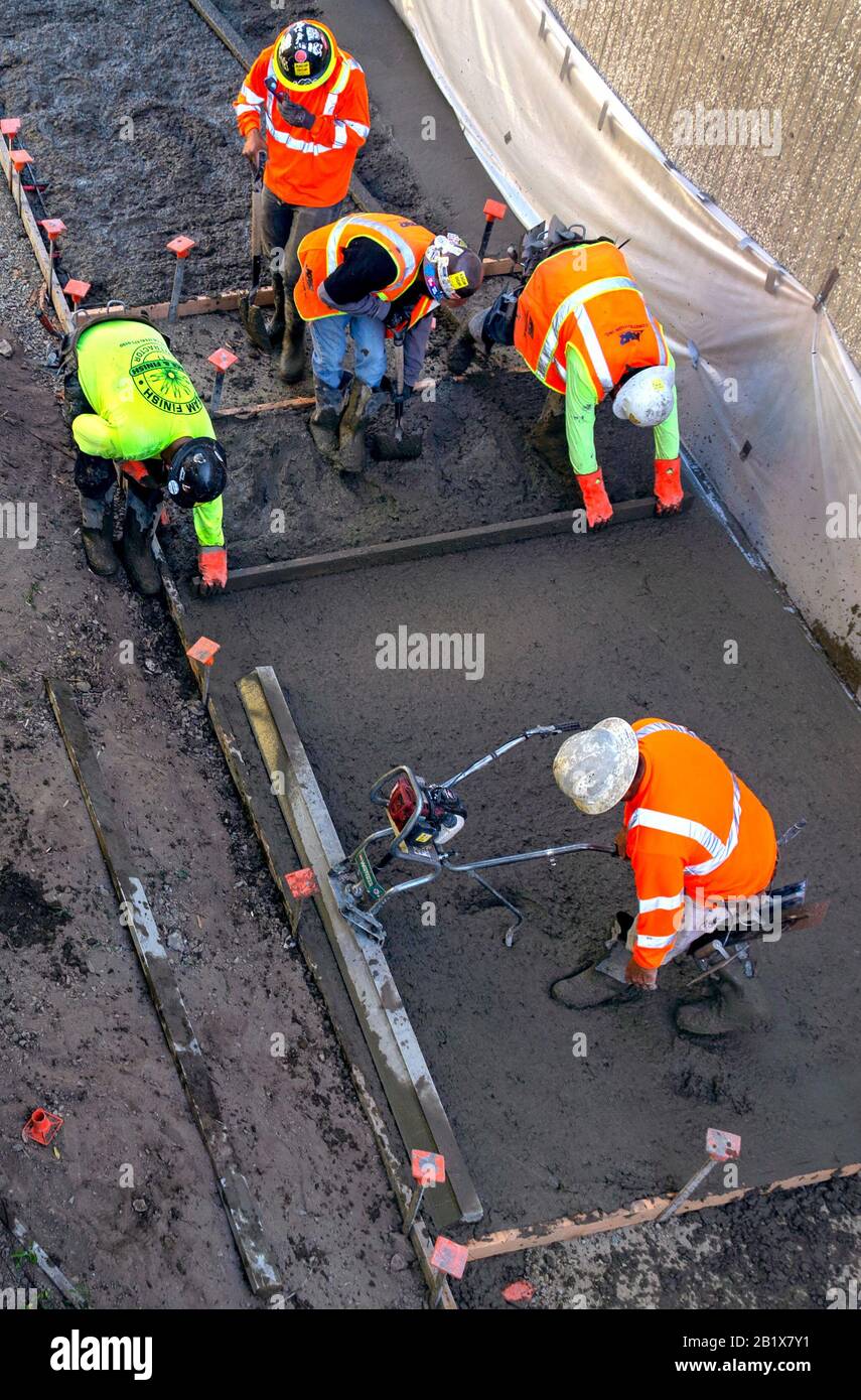 Aerial view of construction workers on a building site. Stock Photo