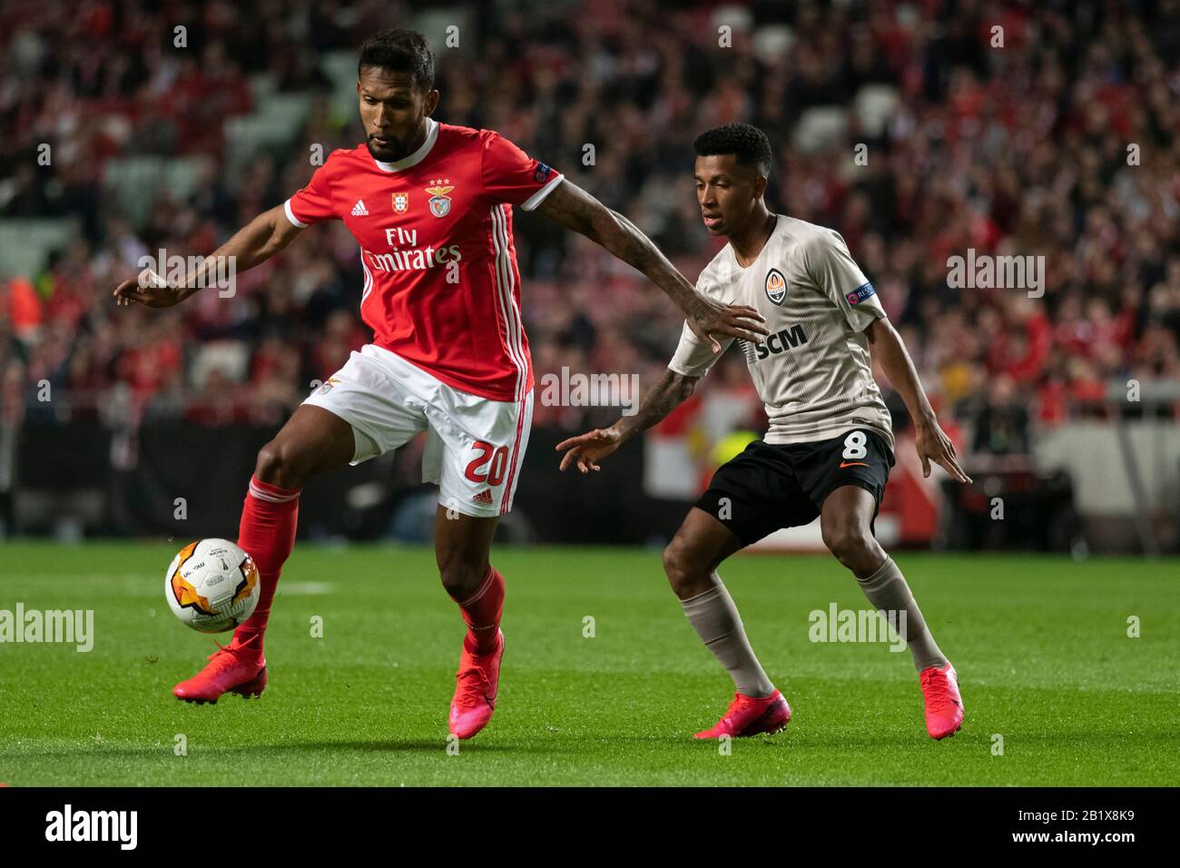 Lisbon, Portugal. 27th Feb, 2020. Dyego Sousa of SL Benfica (L) and Marcos Antonio (R) of FC Shakhtar Donetsk are seen in action during the UEFA Europa League Match 2019/20 between SL Benfica and FC Shakhtar Donetskt at Estádio da Luz in Lisbon.(Final score: SL Benfica 3:3 FC Shakhtar Donetskt) Credit: SOPA Images Limited/Alamy Live News Stock Photo