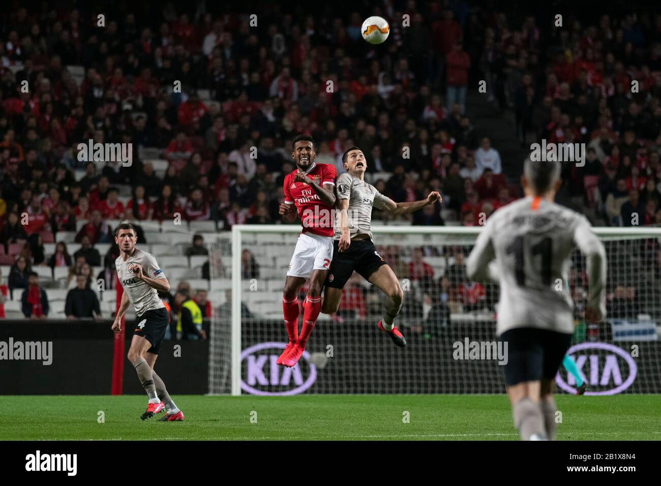 Lisbon, Portugal. 27th Feb, 2020. Dyego Sousa of SL Benfica and Taras Stepanenko of FC Shakhtar Donetsk are seen in action during the UEFA Europa League Match 2019/20 between SL Benfica and FC Shakhtar Donetskt at Estádio da Luz in Lisbon.(Final score: SL Benfica 3:3 FC Shakhtar Donetskt) Credit: SOPA Images Limited/Alamy Live News Stock Photo