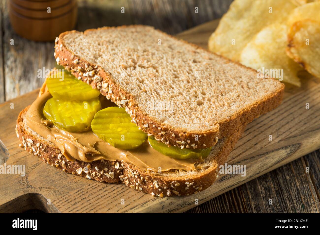 Homemade Peanut Butter And Pickle Sandwich With Chips Stock Photo Alamy