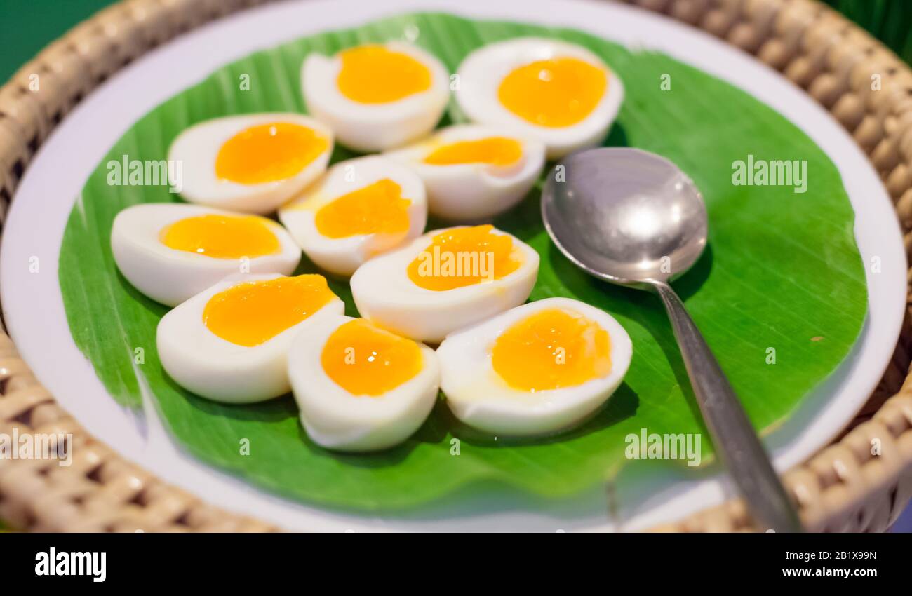 Selective Focused Halved Boiled Chicken Eggs Served In Green