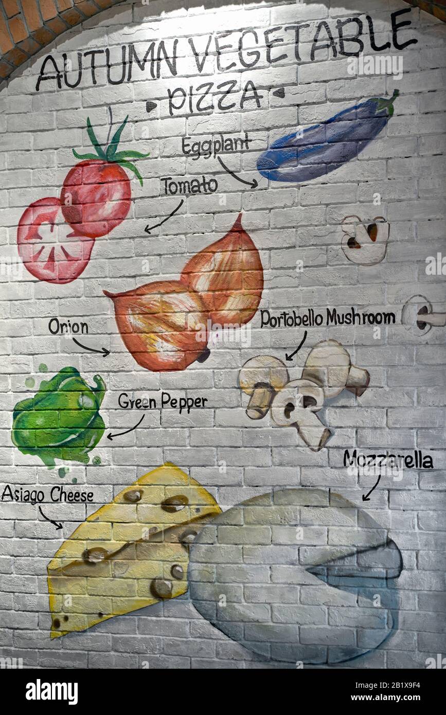 Wall art itemising the food ingredients for a vegetable Pizza at an Italian resturant Stock Photo