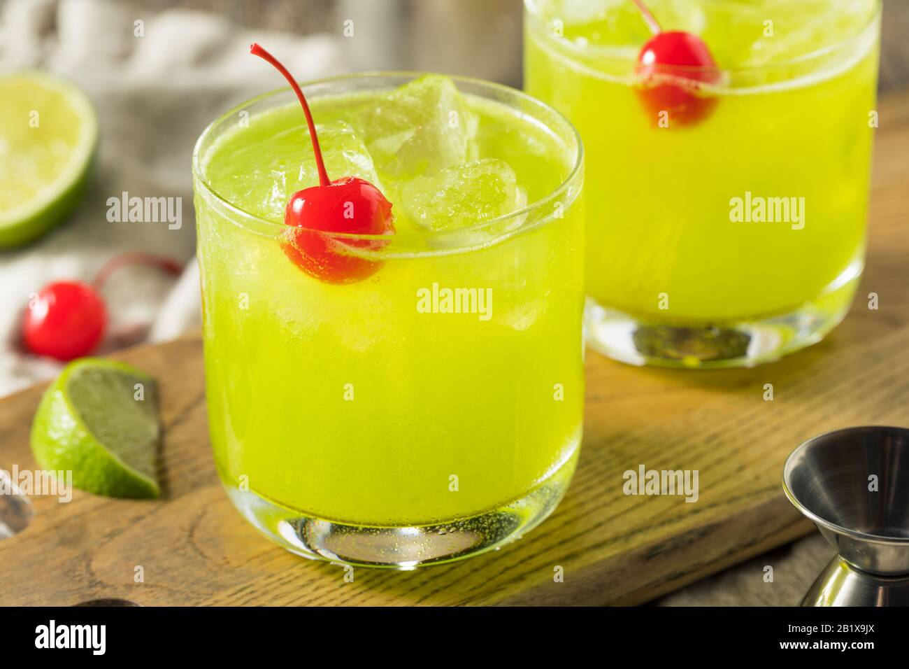 Homemade Green Melon Midori Sour with a Red Cherry Stock Photo Alamy
