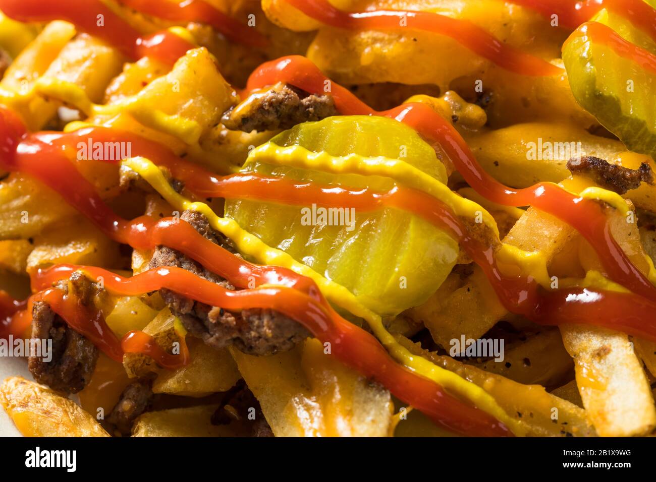 Homemade Loaded Cheeseburger Cheese Fries with PIckles and Ketchup