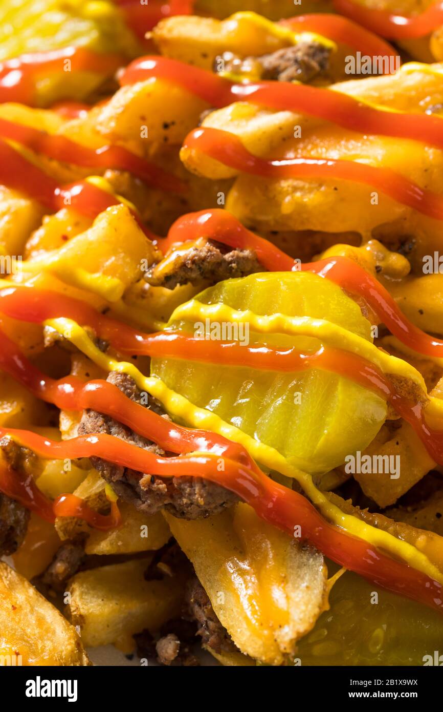 Homemade Loaded Cheeseburger Cheese Fries with PIckles and Ketchup Stock Photo Alamy