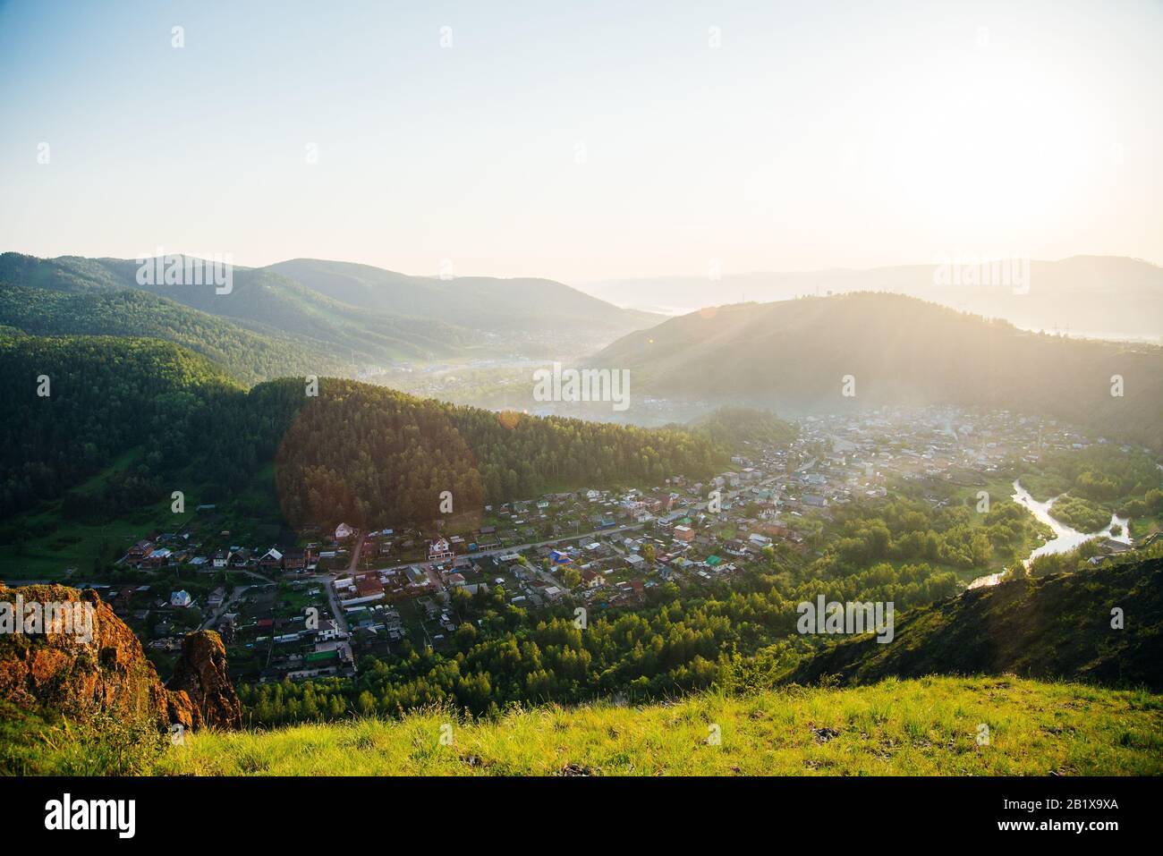 Panoramic view of Krasnoyarsk from the surrounding mountains in the evening Stock Photo