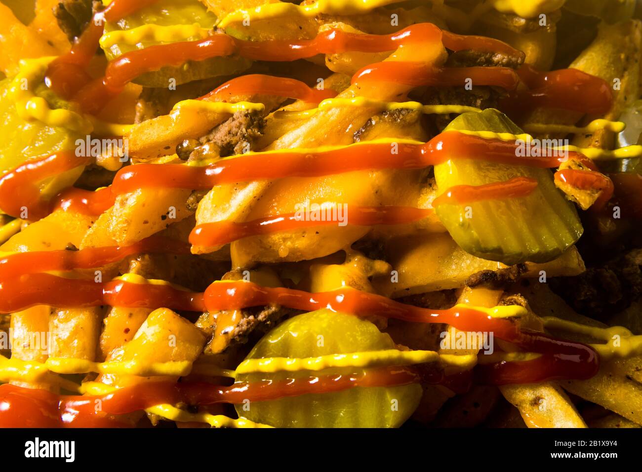 Homemade Loaded Cheeseburger Cheese Fries with PIckles and Ketchup