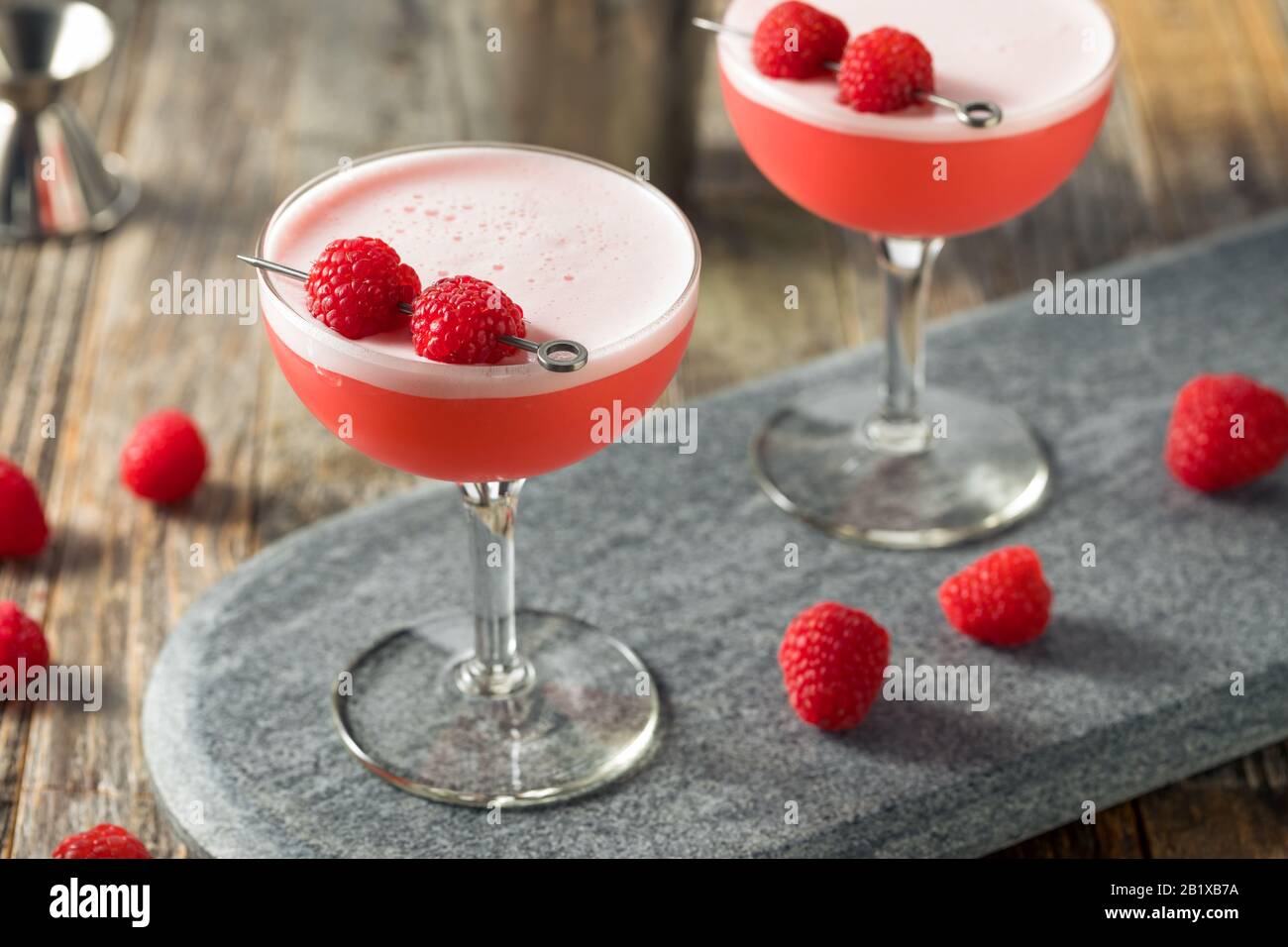 Boozy Pink Clover Club Cocktail with Raspberries Stock Photo