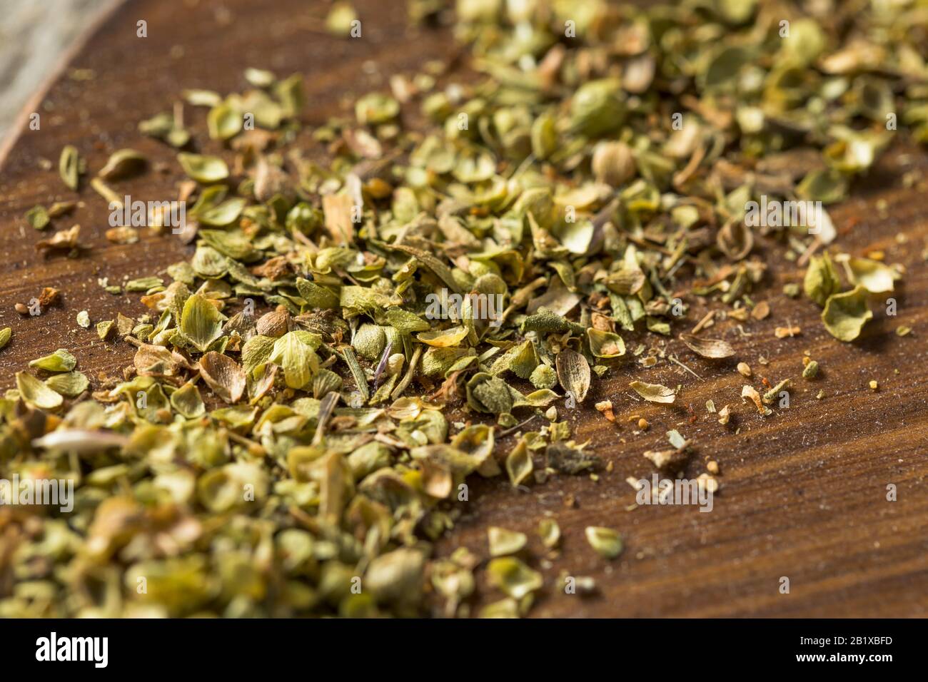 Raw Dried Green Greek Oregano Spice in a Bowl Stock Photo