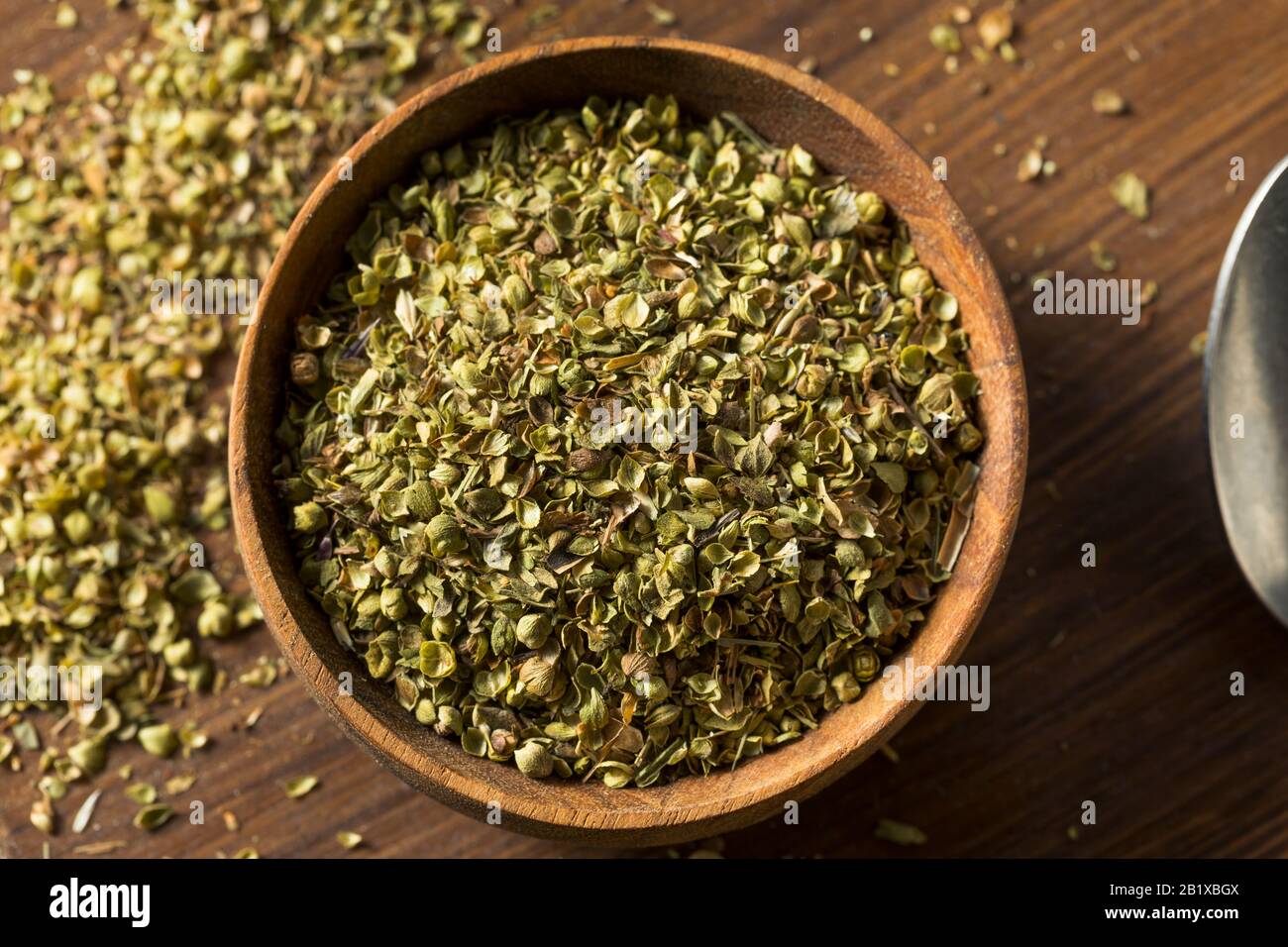 Raw Dried Green Greek Oregano Spice in a Bowl Stock Photo