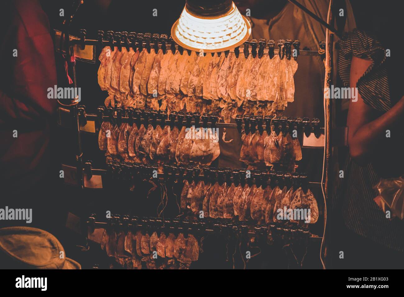 Grilled dried squid, a traditional street food and snack in Thailand
