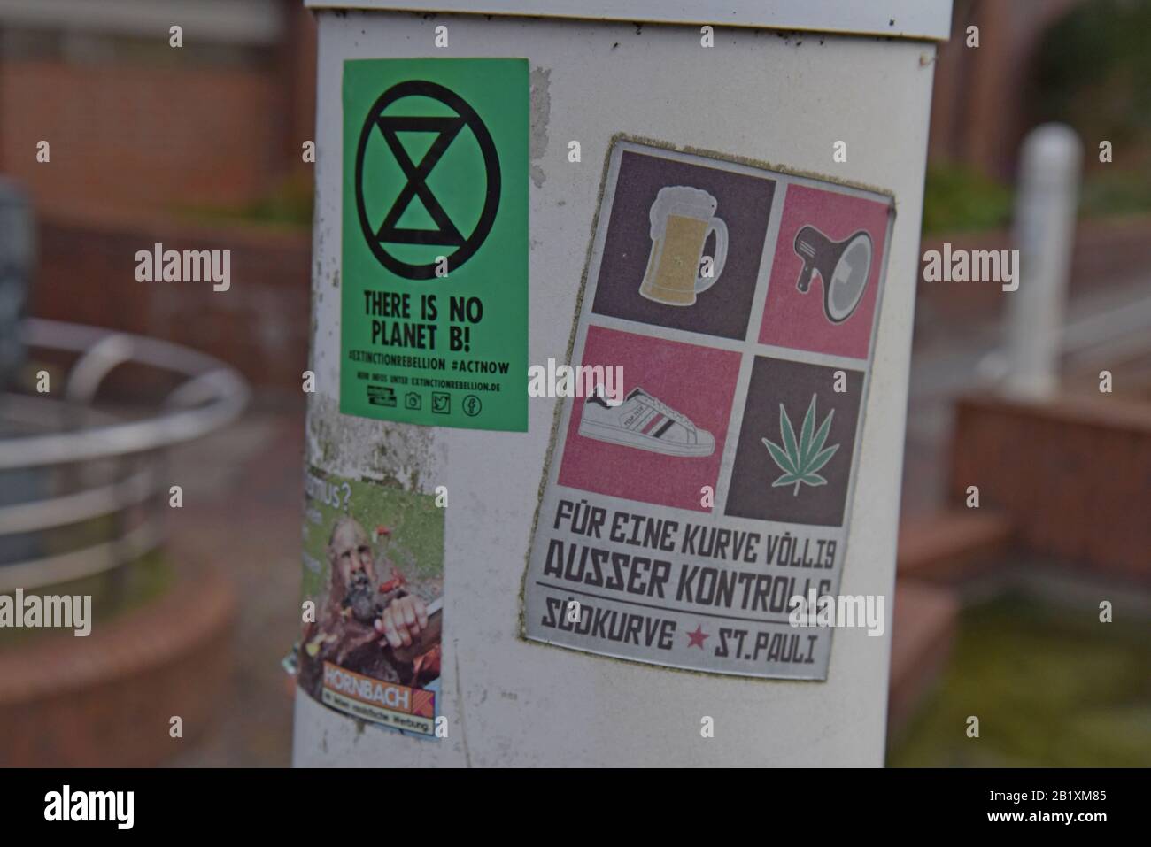 An Extinction Rebellion sticker flyposted on a lamppost in Buxtenhude, Germany Stock Photo