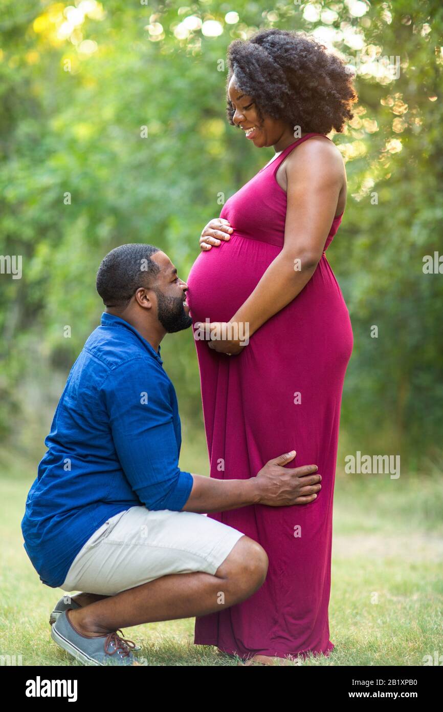 Portrait of a happy pregnant African American couple Stock Photo Alamy
