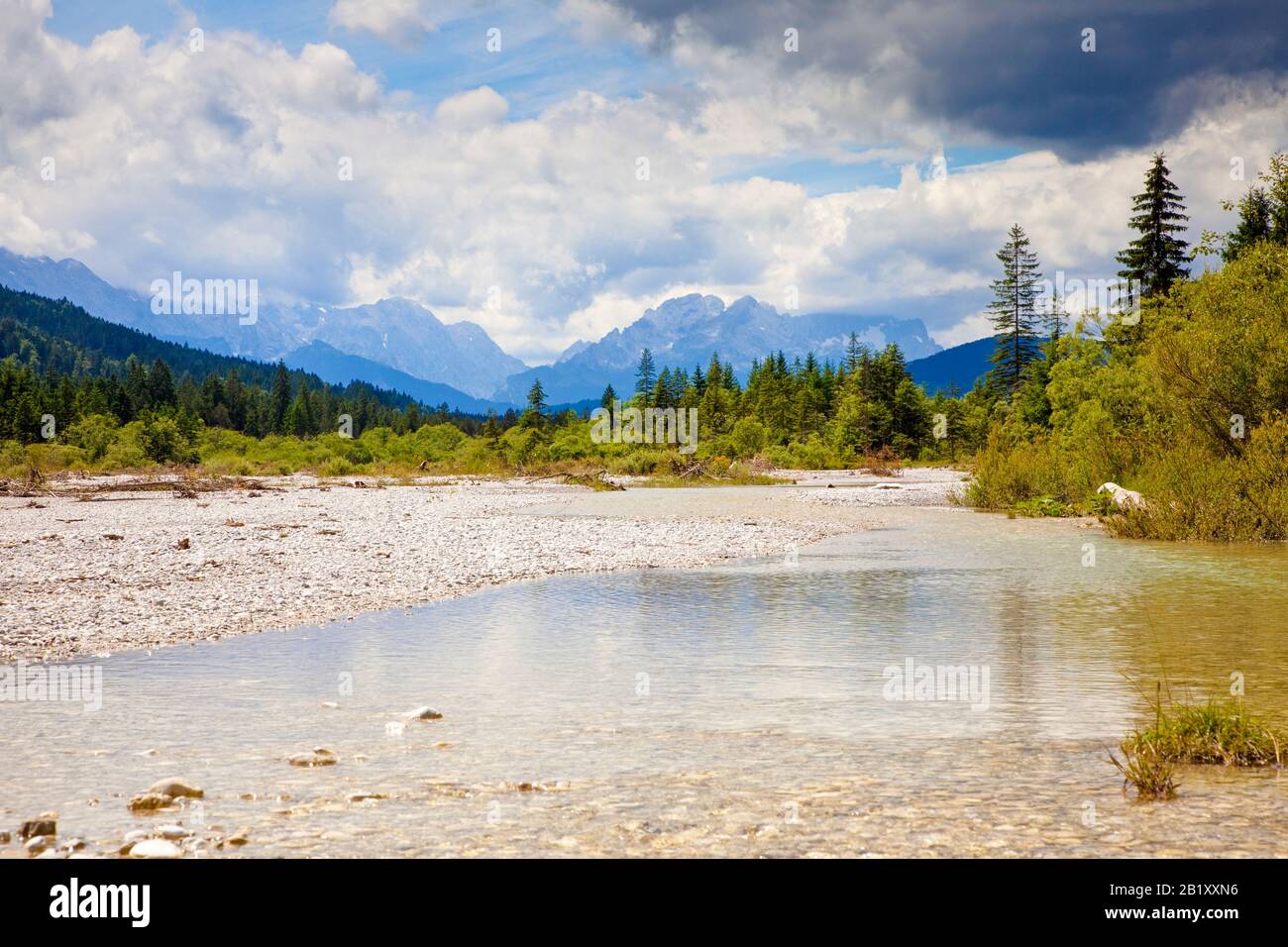 View along the partially dry bed of the River Isar in summer, Bavarian Alps, Bavaria, Germany, towards the Wetterstein mountains Stock Photo