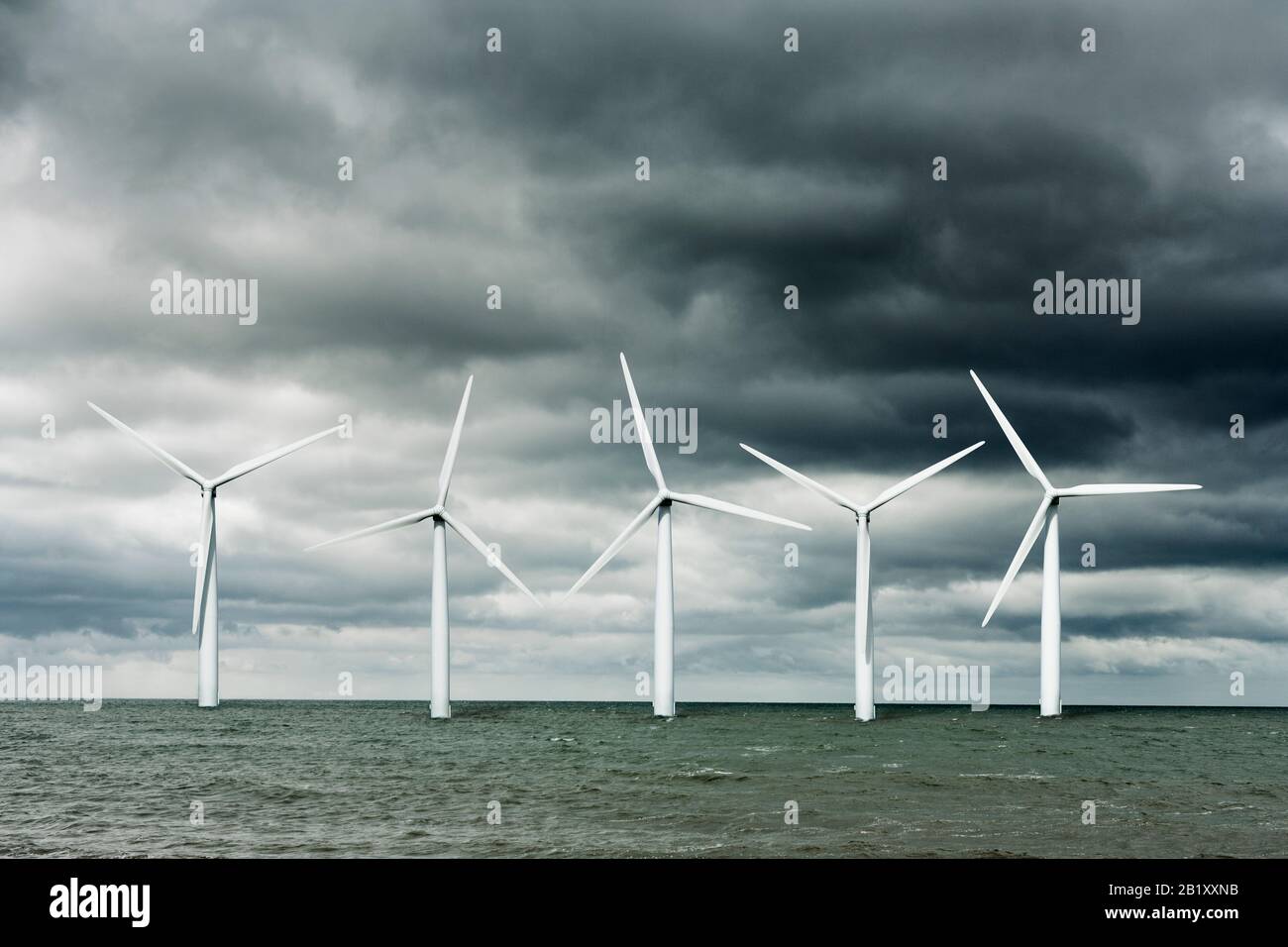 Wind farm at sea, offshore wind turbines (digital composite) Stock Photo