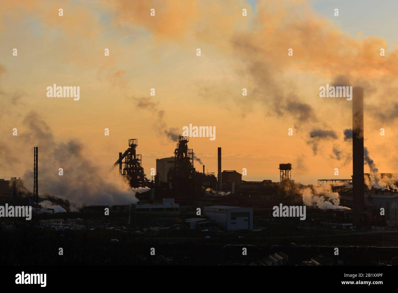 Port Talbot steel works emitting clouds of steam in the evening light Port Talbot Swansea Glamorgan Wales Stock Photo