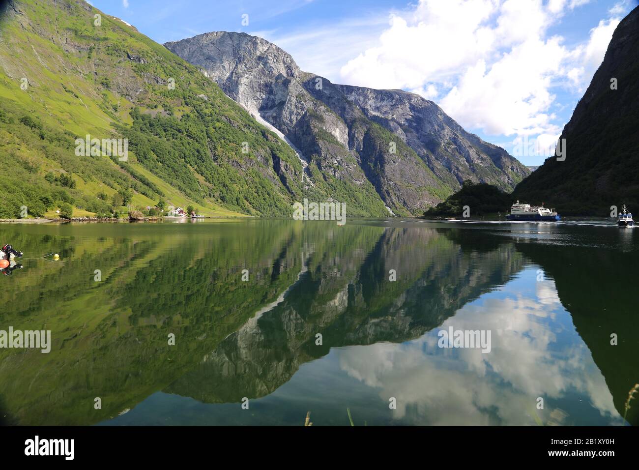 Naeroyfjord idyllic fjord landscape reflection, ship ferry, Norway, scandinavia Stock Photo